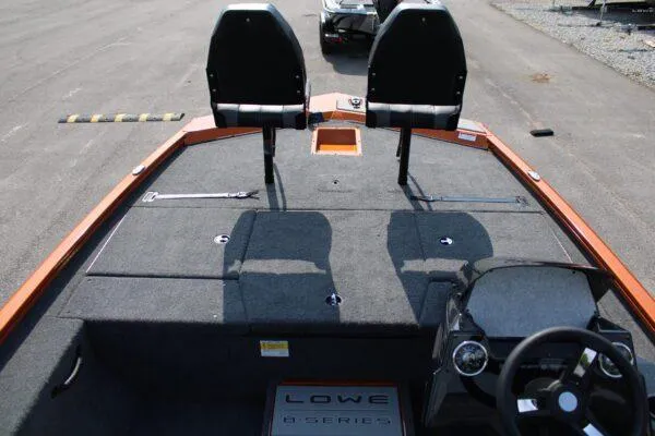 Slide: The Image of 2023 Lowe Stinger 178 boat interior with dual seats and steering console. - 5