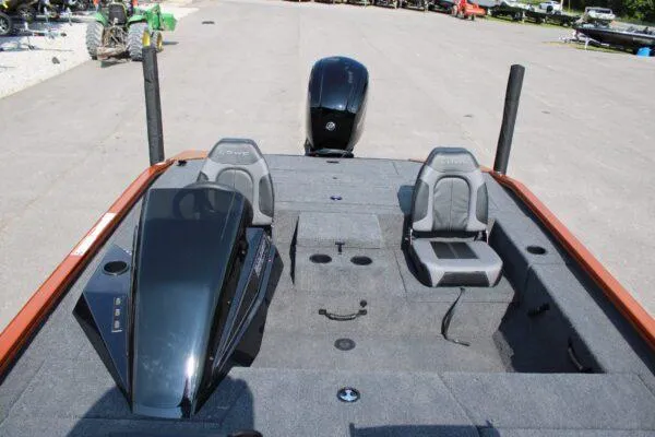 Slide: The Image of 2023 Lowe Stinger 178 fishing boat interior with dual seats and outboard motor. - 8