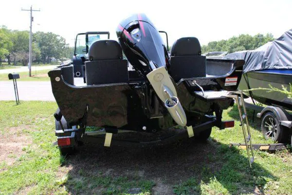Slide: The Image of 2023 Lowe FM1800 boat with outboard motor, rear view. - 3