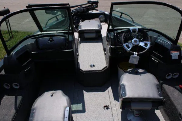 Slide: The Image of 2023 Lowe FM1800 boat interior with steering wheel and seating. - 4