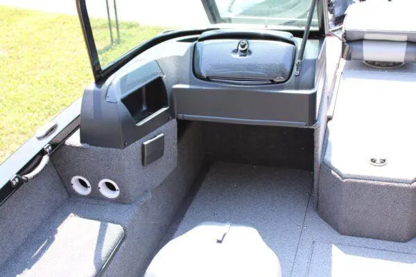 Slide: The Image of 2023 Lowe FM1800 boat interior with storage compartments and seating. - 8