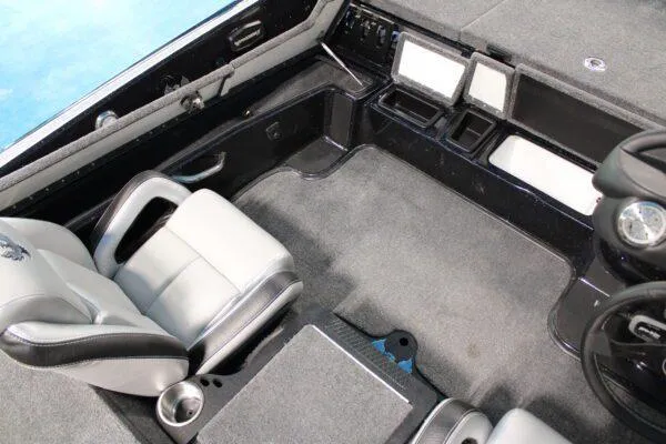 Slide: The Image of 2023 Phoenix 921 ELITE boat interior with gray seats and advanced dashboard. - 12