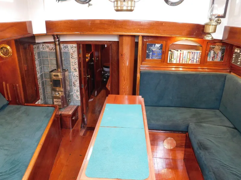 Slide: The Image of Interior of 1983 Custom Murray Peterson Coaster III with wood paneling and cozy seating. - 1