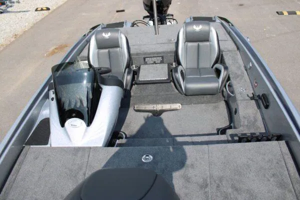 Slide: The Image of 2024 Phoenix 818 boat interior with dual seats and console. - 8