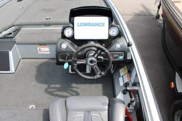 Slide: The Image of 2017 Nitro Z20 boat dashboard with Lowrance electronics and steering wheel. - 3
