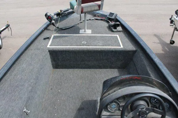 Slide: The Image of 1997 Xpress H56 fishing boat interior with steering console and seating. - 5