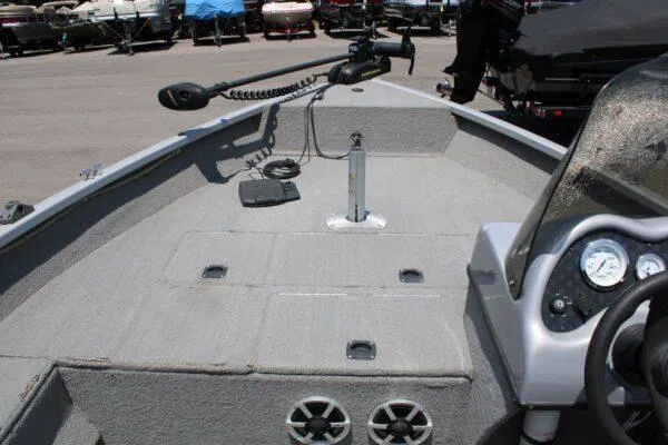 Slide: The Image of 2008 Tracker PRO GUIDE V17 boat interior with steering console and trolling motor. - 3