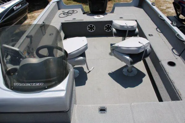 Slide: The Image of 2008 Tracker PRO GUIDE V17 boat interior with seating and steering console. - 4
