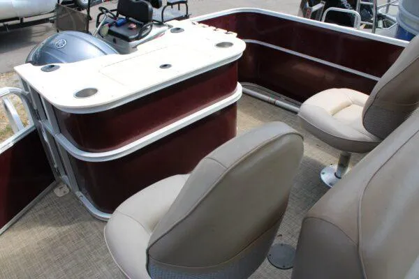 Slide: The Image of Interior of a 2015 G3 X22 boat with beige seats and a control console. - 4