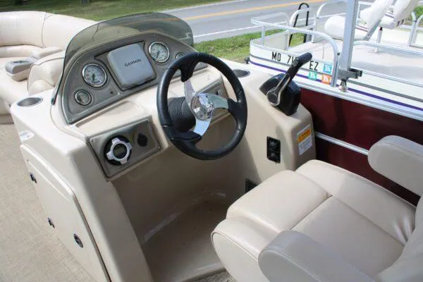 Slide: The Image of 2015 G3 X22 boat dashboard with steering wheel and Garmin GPS system. - 6