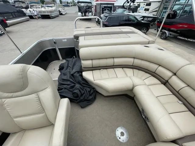 Slide: The Image of 2014 Starcraft Limited 236 pontoon boat with beige leather seating. - 10