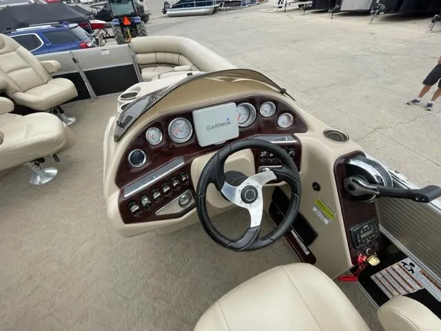 Slide: The Image of 2014 Starcraft Limited 236 boat dashboard with Garmin navigation system. - 16
