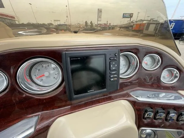 Slide: The Image of 2014 Starcraft Limited 236 boat dashboard with Garmin GPS and gauges. - 17