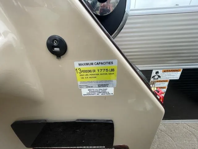 Slide: The Image of 2014 Starcraft Limited 236 maximum capacities label, 13 persons or 1775 lbs. - 18