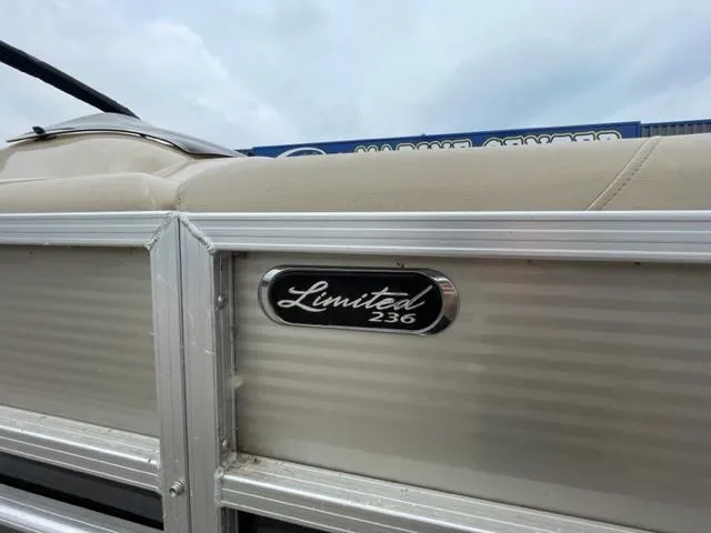 Slide: The Image of 2014 Starcraft Limited 236 boat side view with logo. - 2