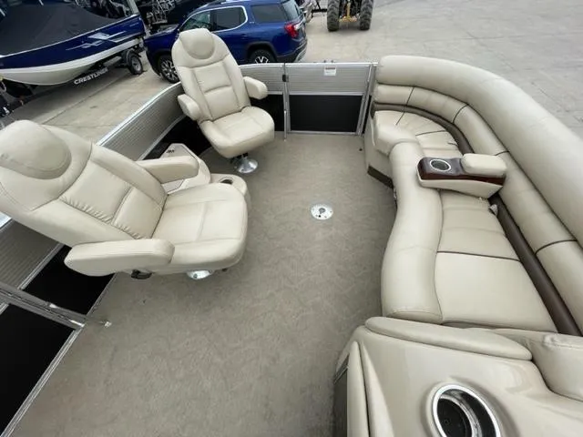Slide: The Image of 2014 Starcraft Limited 236 pontoon boat with beige leather seating. - 20