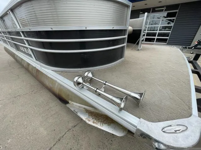 Slide: The Image of 2014 Starcraft Limited 236 pontoon boat front view with dual air horns. - 3