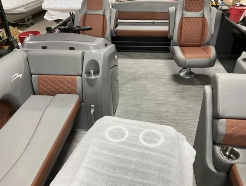 Slide: The Image of 2022 Bennington 23 LSB Swingback interior with gray and brown seating. - 5