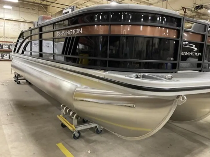 Slide: The Image of 2022 Bennington 23 LSB Swingback pontoon boat in a warehouse. - 9