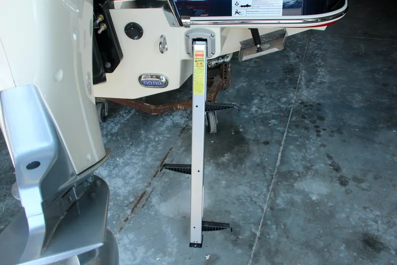 Slide: The Image of 2022 Chris-Craft Launch 25 GT boat trailer support on concrete floor. - 11