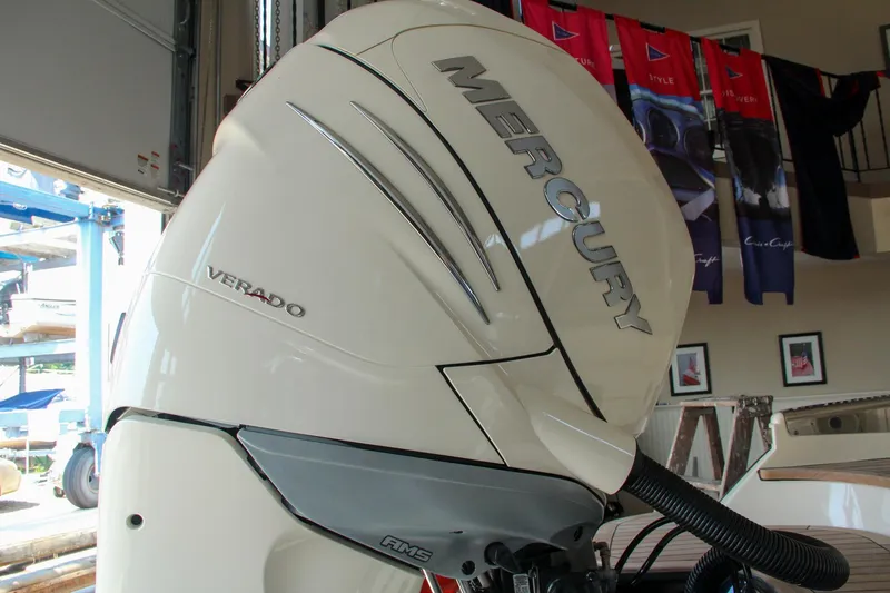 Slide: The Image of 2022 Chris-Craft Launch 25 GT with Mercury Verado engine in showroom. - 12