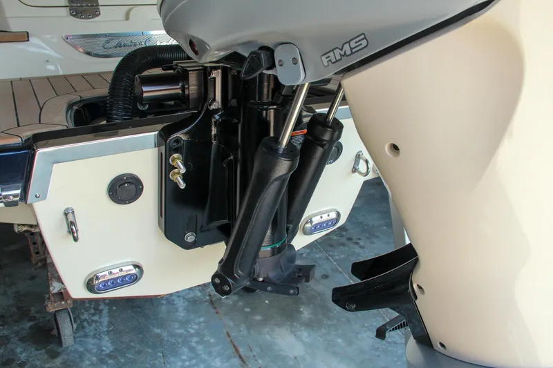 Slide: The Image of 2022 Chris-Craft Launch 25 GT boat engine detail in a garage setting. - 13