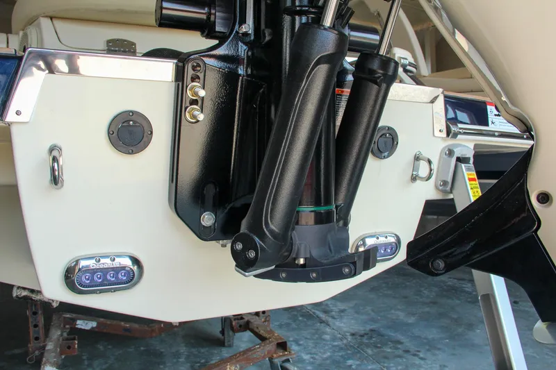 Slide: The Image of 2022 Chris-Craft Launch 25 GT boat stern with hydraulic components and LED lights. - 14