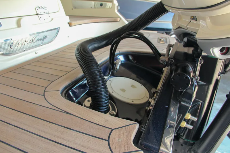 Slide: The Image of 2022 Chris-Craft Launch 25 GT boat engine compartment with teak decking and sleek design. - 15