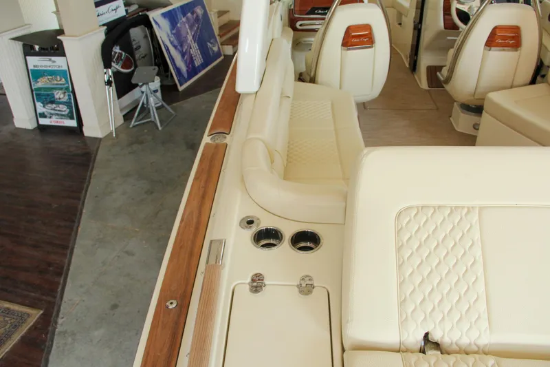 Slide: The Image of 2022 Chris-Craft Launch 25 GT interior with beige seating and wood accents. - 39