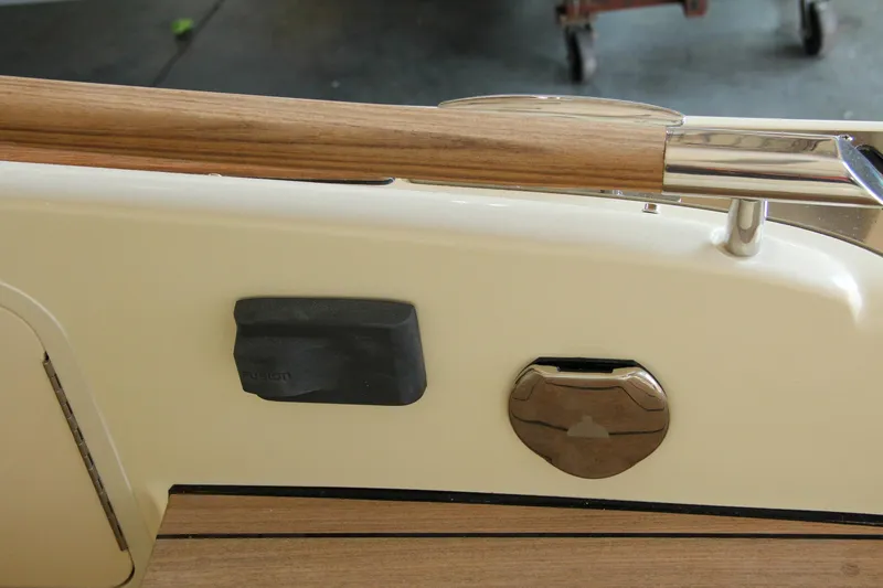 Slide: The Image of 2022 Chris-Craft Launch 25 GT boat detail with wood and metal accents. - 40