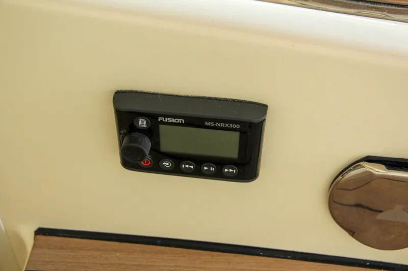 Slide: The Image of 2022 Chris-Craft Launch 25 GT audio control panel, featuring Fusion MS-NRX300. - 41