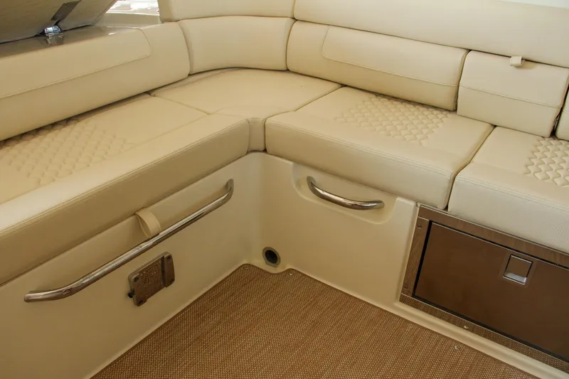 Slide: The Image of 2022 Chris-Craft Launch 25 GT interior with beige leather seating and storage. - 49