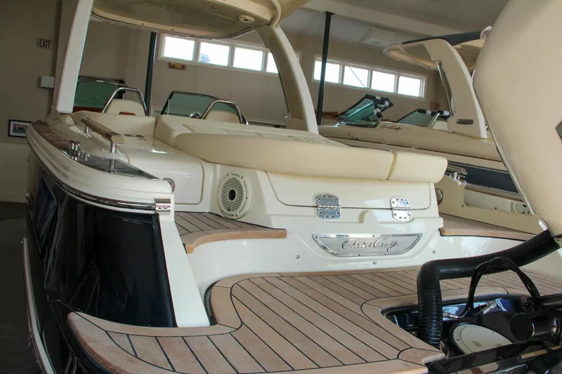 Slide: The Image of 2022 Chris-Craft Launch 25 GT boat with elegant teak decking and luxurious seating. - 8