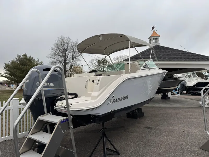 Slide: The Image of 2024 Sailfish 226 boat with Yamaha engine on display outdoors. - 1