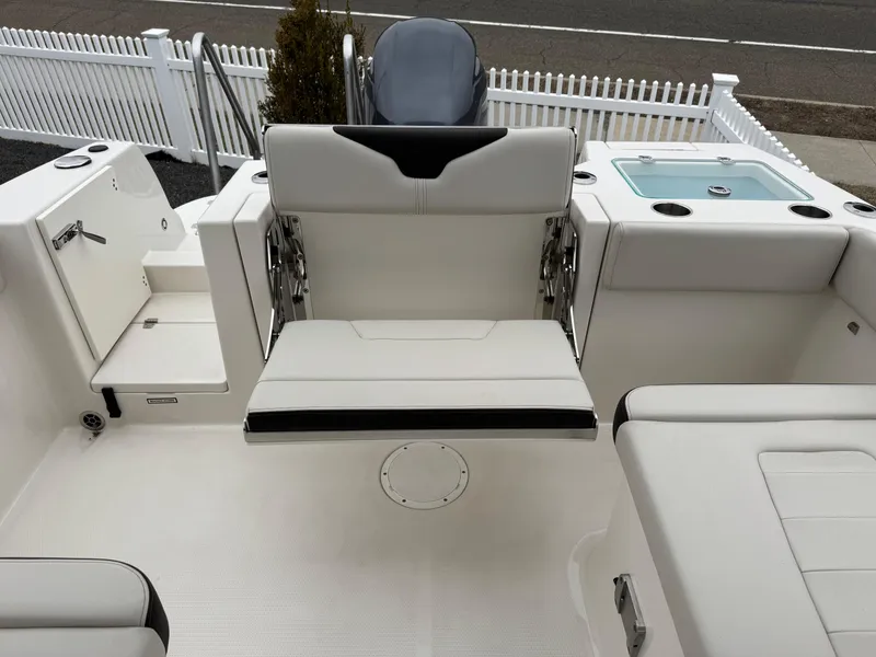 Slide: The Image of 2024 Sailfish 226 boat interior with foldable seating and storage compartments. - 11