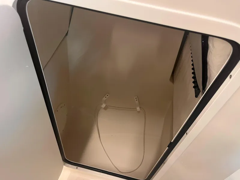 Slide: The Image of Storage compartment inside 2024 Sailfish 226 boat, featuring a clean, spacious interior. - 12