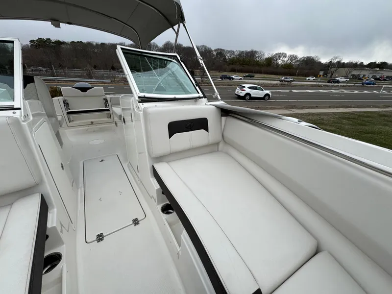 Slide: The Image of 2024 Sailfish 226 boat interior with white seating and open deck view. - 4