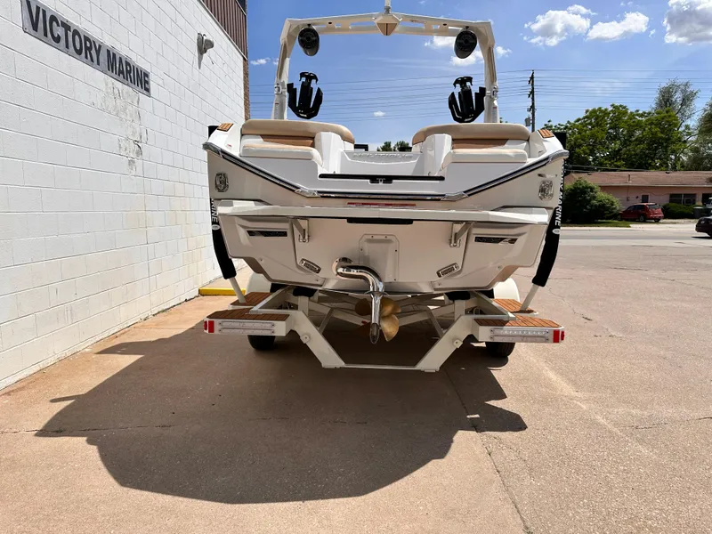 Slide: The Image of 2023 Nautique G21 boat at Victory Marine dealership. - 3