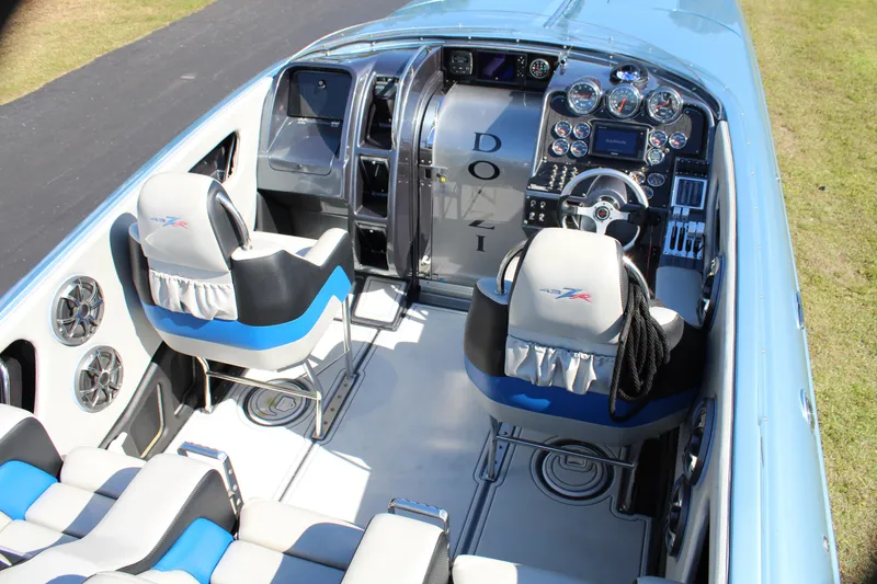 Slide: The Image of 2006 Donzi 43 ZR boat interior with modern dashboard and seating. - 26