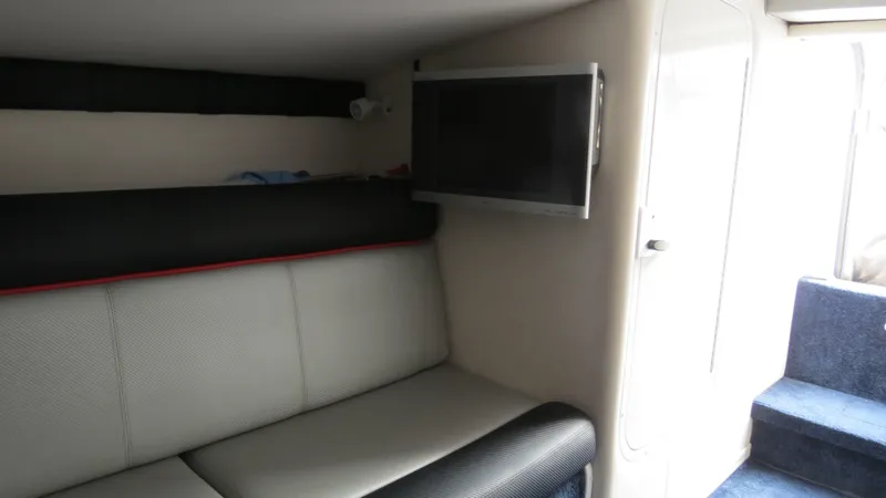 Slide: The Image of Interior of 2006 Donzi 43 ZR boat with sofa and wall-mounted TV. - 35