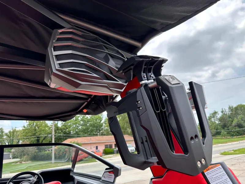 Slide: The Image of 2023 Nautique G23 boat with advanced speaker and wakeboard rack. - 27