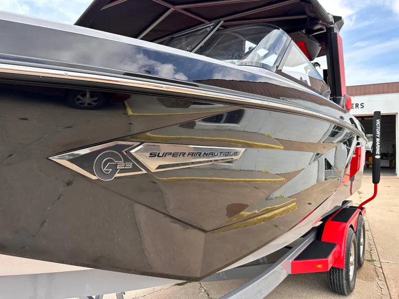 Slide: The Image of 2023 Nautique G23 Super Air Nautique boat on a trailer. - 4