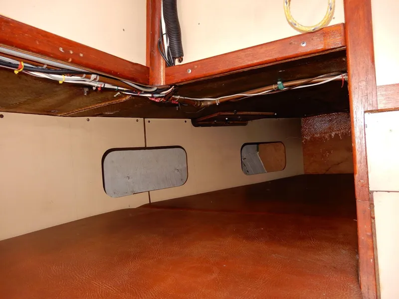 Slide: The Image of 1977 Ted Brewer Jason Pilothouse Offshore interior cabin with wood finish and wiring. - 8