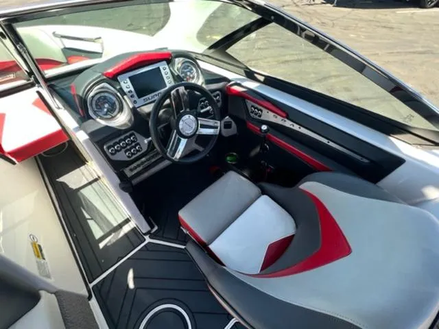 Slide: The Image of 2014 Supra SC350-550 boat cockpit with modern dashboard and steering wheel. - 12