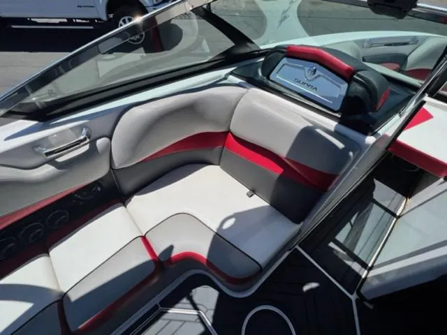 Slide: The Image of 2014 Supra SC350-550 boat interior with red and gray seating. - 13