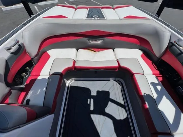 Slide: The Image of Interior seating of a 2014 Supra SC350-550 boat with red and white upholstery. - 15
