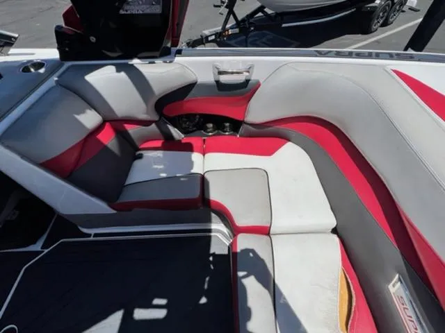 Slide: The Image of 2014 Supra SC350-550 boat interior with red and gray seating. - 16