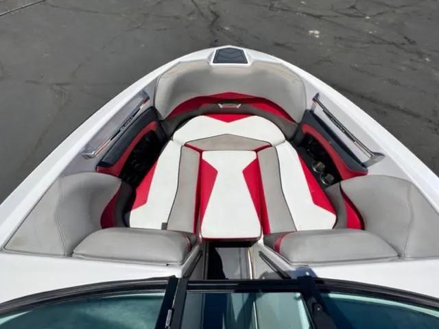 Slide: The Image of 2014 Supra SC350-550 boat with red, white, and gray interior seating. - 17