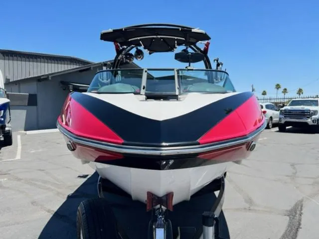 Slide: The Image of 2014 Supra SC350-550 boat with red and black accents, front view. - 3