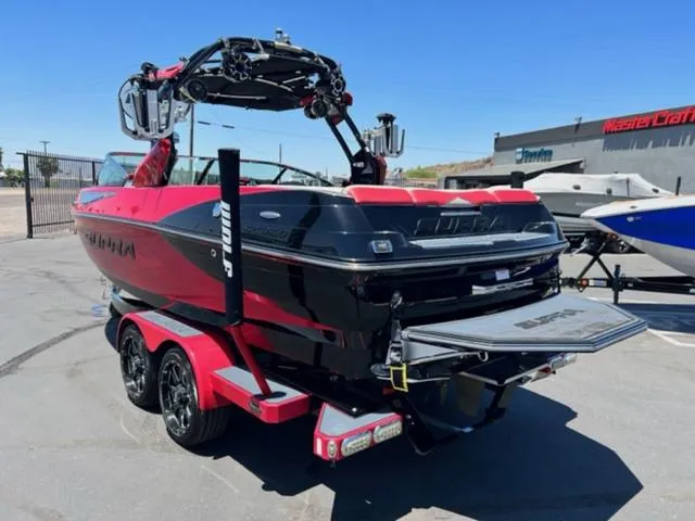 Slide: The Image of 2014 Supra SC350-550 boat on trailer, black and red, rear view. - 9
